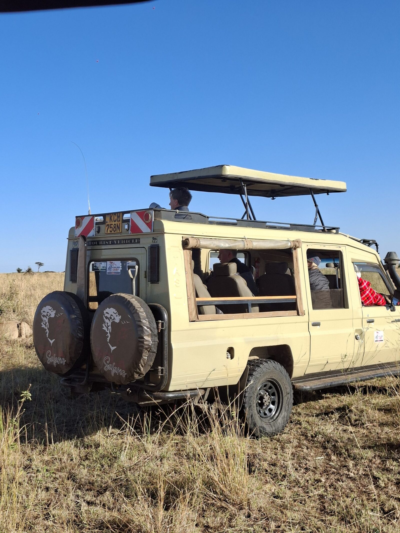 Sola Safaris Vehicle with guests in the wild